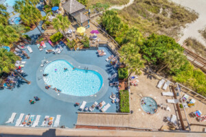 Beach Cove Resort 625 - Balcony View of Pools, Fountains, Hot tubs. Lazy River, and the North Myrtle Beach Shoreline